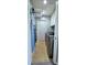 Laundry room including washer, dryer, ironing board and drying rack at 4730 Capital Blvd, St Cloud, FL 34769