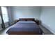 This main bedroom features a comfortable-sized bed and two nightstands at 4730 Capital Blvd, St Cloud, FL 34769