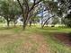 Scenic view of the community park with mature trees and green space at 4730 Capital Blvd, St Cloud, FL 34769