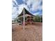 Fun community playground with slides, climbing structures, and protective canopy at 4730 Capital Blvd, St Cloud, FL 34769