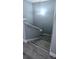 Staircase with wood laminate flooring and hand railing at 4730 Capital Blvd, St Cloud, FL 34769