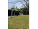 Exterior backyard of a cozy home with a partial covered patio space at 5237 Davisson Ave, Orlando, FL 32810