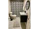 The renovated bathroom features a vanity sink, a decorative shower curtain, and tile floors at 5237 Davisson Ave, Orlando, FL 32810