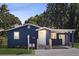 Charming blue single-story home with a covered porch and a well-maintained front yard at 5237 Davisson Ave, Orlando, FL 32810