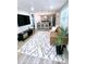 Open concept living room and kitchen with modern gray, black, and stainless steel appliances at 5237 Davisson Ave, Orlando, FL 32810