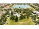 Aerial view of community amenities, including a pool, playground, and a scenic lake at 6008 Golden Dewdrop Trl, Windermere, FL 34786