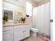 Bathroom with a vanity, toilet, and shower with a curtain at 6008 Golden Dewdrop Trl, Windermere, FL 34786
