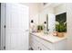 Bathroom with a vanity, mirror, and neutral tones at 6008 Golden Dewdrop Trl, Windermere, FL 34786