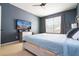 Spacious bedroom featuring a large TV and comfortable furnishings at 6008 Golden Dewdrop Trl, Windermere, FL 34786