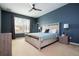 Comfortable bedroom with a ceiling fan and neutral color palette at 6008 Golden Dewdrop Trl, Windermere, FL 34786