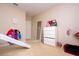 bedroom featuring a slide, chest of drawers, and decor at 6008 Golden Dewdrop Trl, Windermere, FL 34786