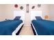 Bedroom with two beds and sports decor at 6008 Golden Dewdrop Trl, Windermere, FL 34786