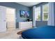 Bedroom with tv, walk-in closet, and windows at 6008 Golden Dewdrop Trl, Windermere, FL 34786