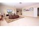 Bright bonus room featuring a comfortable seating area with a large brown beanbag chair and television at 6008 Golden Dewdrop Trl, Windermere, FL 34786