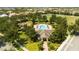 Aerial view of community pool, clubhouse, and playground, enhancing community living at 6008 Golden Dewdrop Trl, Windermere, FL 34786