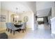 Elegant dining room with stylish chairs, carpeting and view of living room at 6008 Golden Dewdrop Trl, Windermere, FL 34786