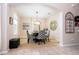 Dining area featuring a modern table with patterned chairs and elegant décor at 6008 Golden Dewdrop Trl, Windermere, FL 34786