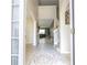 Inviting foyer with tile flooring and a view of the staircase, setting an elegant tone at 6008 Golden Dewdrop Trl, Windermere, FL 34786