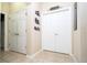 Hallway featuring ample storage and a doorway to the theater room at 6008 Golden Dewdrop Trl, Windermere, FL 34786