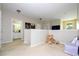 Hallway leading to a bathroom and other rooms; with a charming teddy bear at 6008 Golden Dewdrop Trl, Windermere, FL 34786
