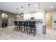 Kitchen with an island with bar seating, pendant lights and stainless steel appliances at 6008 Golden Dewdrop Trl, Windermere, FL 34786