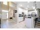 Spacious open-concept kitchen features white cabinets and stainless steel appliances at 6008 Golden Dewdrop Trl, Windermere, FL 34786