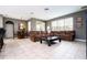 Open-concept living room with large sectional couch and tile flooring at 6008 Golden Dewdrop Trl, Windermere, FL 34786