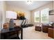 Well-lit living room featuring a treadmill, sofa, and modern décor at 6008 Golden Dewdrop Trl, Windermere, FL 34786