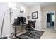 Well-lit home office featuring a modern desk, ergonomic chair, and sleek workstation setup at 6008 Golden Dewdrop Trl, Windermere, FL 34786