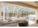 Relaxing screened-in pool with outdoor kitchen and luxurious lounge areas at 6008 Golden Dewdrop Trl, Windermere, FL 34786