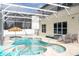 Gorgeous screened-in pool and spa area with a relaxing poolside ambiance at 6008 Golden Dewdrop Trl, Windermere, FL 34786