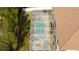 Aerial view of a screened-in pool with patio furniture and a bamboo fence at 6008 Golden Dewdrop Trl, Windermere, FL 34786