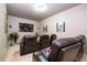 Home theater room with plush seating, a large screen, and movie-themed décor at 6008 Golden Dewdrop Trl, Windermere, FL 34786