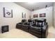 Cozy theater room featuring comfortable seating and movie-inspired decorations at 6008 Golden Dewdrop Trl, Windermere, FL 34786