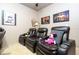Home theater room featuring reclining chairs, movie decor and plush carpeting at 6008 Golden Dewdrop Trl, Windermere, FL 34786
