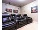 Inviting home theater with comfortable seating and movie-themed accents at 6008 Golden Dewdrop Trl, Windermere, FL 34786
