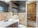 Bathroom showcasing a tiled wall, modern vanity, and combined tub/shower at 6031 W Ridgewood Ave, Orlando, FL 32835