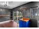 Kitchen featuring dark gray walls, a blue cabinet, shelving, and sliding doors to a porch at 6031 W Ridgewood Ave, Orlando, FL 32835