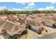 Aerial view of a residential community showcasing well-maintained homes with tidy landscaping and cohesive design at 613 Nuevo Leon Ln, The Villages, FL 32159