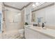 Modern bathroom featuring a glass enclosed shower, vanity, and framed mirror at 613 Nuevo Leon Ln, The Villages, FL 32159