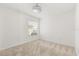 Clean, well-lit bedroom with neutral carpet and blind-covered window at 613 Nuevo Leon Ln, The Villages, FL 32159
