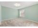 Comfortable bedroom with carpeted floors and natural lighting at 613 Nuevo Leon Ln, The Villages, FL 32159