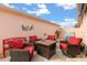 Cozy outdoor patio with seating and decor at 613 Nuevo Leon Ln, The Villages, FL 32159