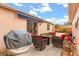 Comfortable patio with cushioned seating and a grill, perfect for outdoor entertaining and relaxing at 613 Nuevo Leon Ln, The Villages, FL 32159