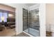 View of bathroom featuring a tiled shower and doorway to bedroom at 7012 Oakwood St, Davenport, FL 33837