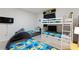 ' bedroom with Minion-themed decor, including bunk beds, TV, and unique beds at 7012 Oakwood St, Davenport, FL 33837