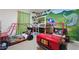 Jurassic Park themed bedroom featuring custom beds and mural at 7012 Oakwood St, Davenport, FL 33837