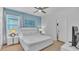 Bright bedroom featuring a king size bed and an ensuite bathroom at 7012 Oakwood St, Davenport, FL 33837