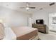 Bedroom with a bed, dresser, and ensuite bathroom at 7012 Oakwood St, Davenport, FL 33837