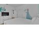 Charming bedroom with a bed, dresser, and whimsical Frozen themed wall decor at 7012 Oakwood St, Davenport, FL 33837
